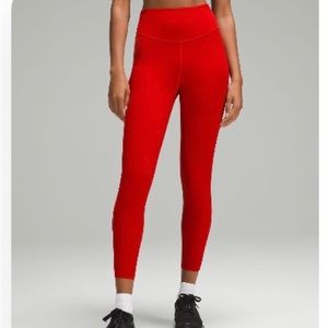 Brand new - never worn! Base pace high rise tight, 25 inch, dark red.